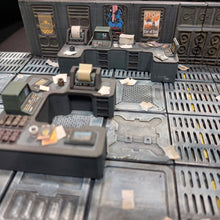 Load image into Gallery viewer, A miniature sci-fi control room tabletop terrain piece featuring gray plastic desks, consoles, and textured floor tiles with printed details.