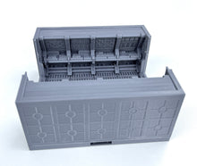 Load image into Gallery viewer, A gray plastic model train track piece or diorama structure, shown open to reveal detailed interior tracks and platforms, on a white background.