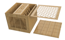 Load image into Gallery viewer, A light natural wood honeycomb storage box shown open, with a honeycomb-patterned lid leaning against it and a separate square bottom panel placed in front, all on a plain white background.
